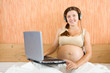 happy pregnant woman with laptop happy pregnant woman with laptop