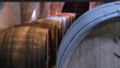 Close up of a corridor full of wine barrels