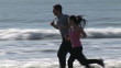 Video: Sporty couple running by the sea Sporty couple running by the sea
