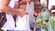 Close up of customers in front of fruits display in a market