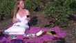 Woman eating pâté on toast in her vineyard