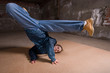 Hip hop dancer in modern style over brick wall