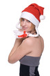 Close up portrait of girl in grey dress and santa claus hat Close up portrait of girl in grey dress and santa claus hat