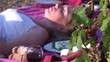 Video: Woman tanning in a vineyard lying on the ground Woman tanning in a vineyard lying on the ground