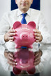 Photo: businessman with piggy bank businessman with piggy bank