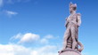 Statue of a commander with blue sky in slow motion