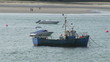 Fishing boat and motor boats in the sea