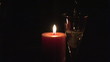 Candle with flute of champagne in the foreground