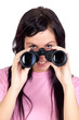 Brunette girl looking through binoculars