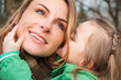 Woman listnening her daugther with smile Woman listnening her daugther with smile