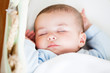 Portrait of a sleeping baby lying in his cradle Portrait of a sleeping baby lying in his cradle