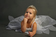 Photo: Very cute thinking 3 years old ballerina girl in white dress Very cute thinking 3 years old ballerina girl in white dress