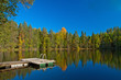Jetty from sauna to lake with beutiful colors on autumn and refl