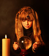 Child holding crystal ball.