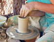 close up of the hands of a potter