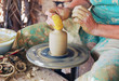 close up of the hands of a potter close up of the hands of a potter
