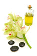 massage oil and stones with orchids