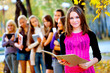 many students in the autumn park