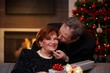 Senior woman getting christmas present