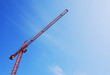 red tower crane blue sky