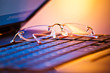 eyeglasses on laptop computer