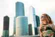 Businesswoman near modern buildings Businesswoman near modern buildings