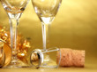Champagne glasses on golden background