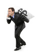 Full length portrait of a businessman carrying a money bag