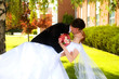 Groom dipping wife