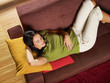 woman sleeping on sofa