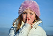 young girl showing the quiet please sign