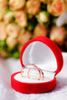 Gold rings and a bouquet of roses