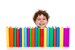 Boy sitting behind pile of books isolated on white Boy sitting behind pile of books isolated on white