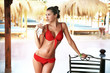 Beautiful brunette drinking water on a vacation day
