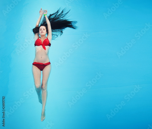 Photo: Young woman in swimming pool Young woman in swimming pool