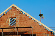 gable of a building fabric after topping-out ceremony
