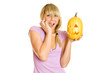 Girl terrified screams with a pumpkin for Halloween