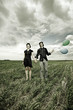 A Couple Standing in a Field. A Couple Standing in a Field.