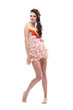 Beautiful barefoot brunette woman posing in floral dress Beautiful barefoot brunette woman posing in floral dress