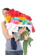 Photo: Young Woman with Pile of Washing. Model Released Young Woman with Pile of Washing. Model Released