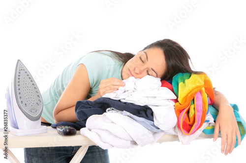 Photo: Young Woman Asleep on Pile of Ironing. Model Released Young Woman Asleep on Pile of Ironing. Model Released