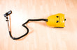 Vacuum cleaner on the polished wooden floor Vacuum cleaner on the polished wooden floor