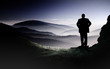 Valley with silhouette of a man