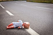 Photo: doll leave on a highway lane doll leave on a highway lane