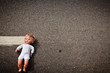 Photo: doll leave on a highway lane doll leave on a highway lane