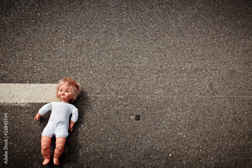 Photo: doll leave on a highway lane doll leave on a highway lane