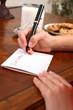 Boy or girl writing a letter to Santa