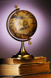 Antique globe on books
