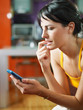 nervous woman holding cellphone