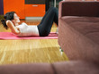 woman doing abs exercise at home